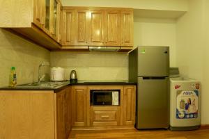 A kitchen or kitchenette at Alaya 1 Apartment