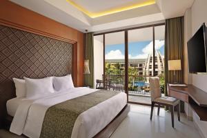 TV a/nebo společenská místnost v ubytování Golden Tulip Jineng Resort Bali