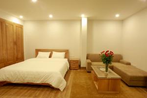 Giường trong phòng chung tại Alaya 1 Apartment