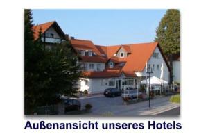 a picture of a town with houses and a street at Hotel Walz in Salzkotten