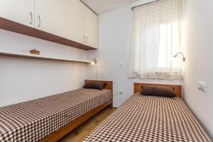 Postel nebo postele na pokoji v ubytování Villa Antonina