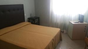 Postel nebo postele na pokoji v ubytování Hotel ILLI