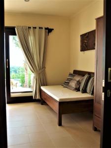 Cama o camas de una habitación en West Bali Villas-Umasari Resort