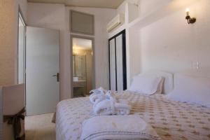 Кровать или кровати в номере Mare Vista Hotel - Epaminondas