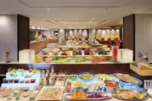 a buffet line with many different types of food at Asaya in Nikko