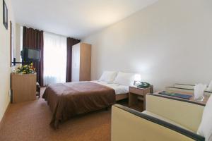 Postel nebo postele na pokoji v ubytování Hotel Mures