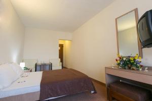 Postel nebo postele na pokoji v ubytování Hotel Mures