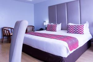 Ein Bett oder Betten in einem Zimmer der Unterkunft Gelian Hotel