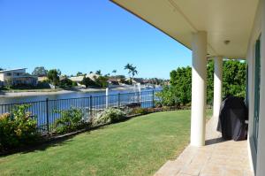 a porch of a house with a view of the water at Bayz Maroochy Waters in Maroochydore