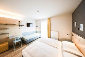 Posteľ alebo postele v izbe v ubytovaní Hotel Tullnerfeld