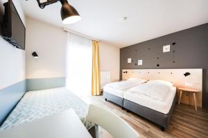 Voodi või voodid majutusasutuse Hotel Tullnerfeld toas