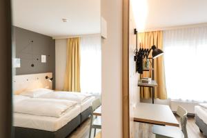 Voodi või voodid majutusasutuse Hotel Tullnerfeld toas