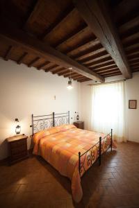 Ένα ή περισσότερα κρεβάτια σε δωμάτιο στο Agriturismo Casone
