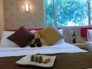 Postel nebo postele na pokoji v ubytování Carlsun Hotel