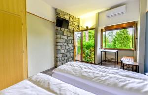 Postel nebo postele na pokoji v ubytování Hotel Bungalows Europa