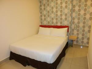 Postel nebo postele na pokoji v ubytování Carlsun Hotel