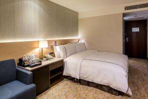 Postel nebo postele na pokoji v ubytování K Hotel Tianjin