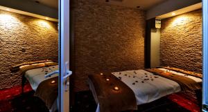 a room with two twin beds in it with lights at Gülhanepark Hotel & Spa in Istanbul