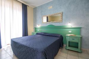 Postel nebo postele na pokoji v ubytování Hotel San Francisco