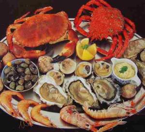 a plate of lobster and other seafood on a table at Sacred Mountain Retreat in Nambucca Heads