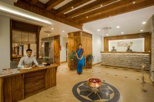 a man and a woman standing in a salon at Pokhara Batika in Pokhara