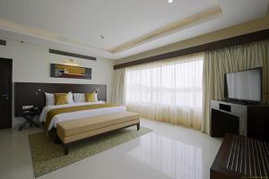 Hotel Naveen Lakeside客房内的一张或多张床位
