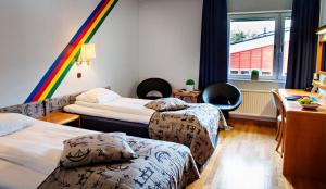 Postel nebo postele na pokoji v ubytování Hotel Jokkmokk