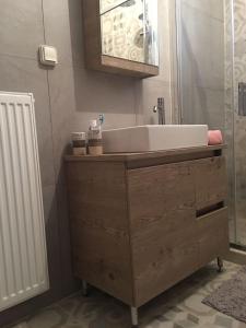 a bathroom with a sink and a bath tub at Leo's city apartment in Lefkada +12 photos