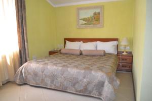 a bedroom with a large bed in a room at Hotel Strike in Vinnytsya