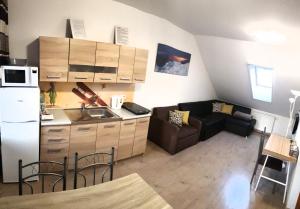 Kuchyňa alebo kuchynka v ubytovaní Apartmány Malý Princ