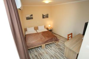 Postel nebo postele na pokoji v ubytování Hotel Hana