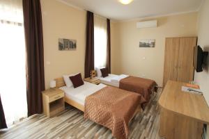 Postel nebo postele na pokoji v ubytování Hotel Hana