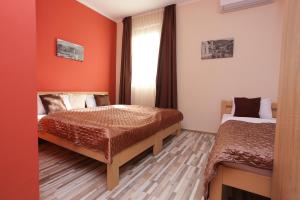 Postel nebo postele na pokoji v ubytování Hotel Hana