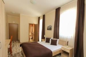 Postel nebo postele na pokoji v ubytování Hotel Hana