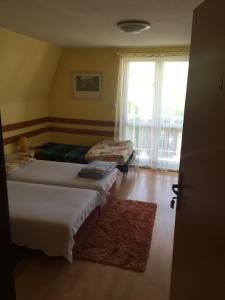 Postel nebo postele na pokoji v ubytování Apartmány Ingrid