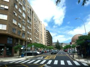 an empty city street with cars parked on the street at Sweet Home in Santa Cruz de Tenerife