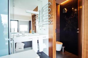 a bathroom with a sink and a mirror at ION City Hotel, Reykjavik, a Member of Design Hotels in Reykjavík