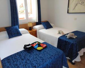 Cama o camas de una habitación en El Rincón de Antonio