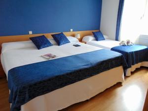 Cama o camas de una habitación en El Rincón de Antonio