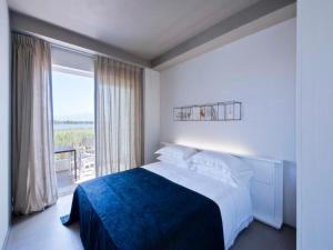 Postel nebo postele na pokoji v ubytování Il Fogliano Hotel New Life