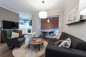 TV i/ili zabavni centar u objektu Sunset Beach Apartment
