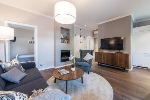 TV i/ili zabavni centar u objektu Sunset Beach Apartment