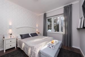 Krevet ili kreveti u jedinici u objektu Sunset Beach Apartment