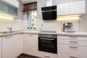 Kuhinja ili čajna kuhinja u objektu Sunset Beach Apartment