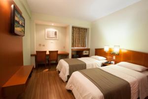 Postel nebo postele na pokoji v ubytování Hotel Moncloa