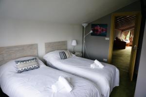 Кровать или кровати в номере Aloka rooms Sopela