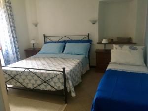 Postel nebo postele na pokoji v ubytování Agriturismo La Ferriera