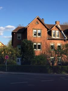 a large brick building with windows on a street at Festspiel Apart Tristan in Bayreuth