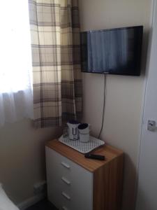 A television and/or entertainment centre at Rembrandt Guest House
