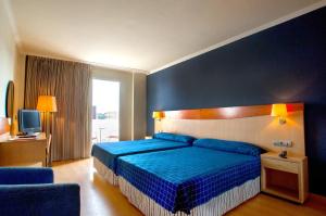 Posteľ alebo postele v izbe v ubytovaní Hotel President